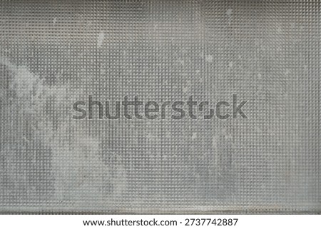 mosaic pattern on a dirty window glass                                
