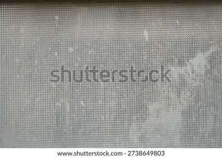 mosaic pattern on a dirty window glass                                  