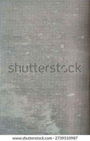 mosaic pattern on a dirty window glass                                