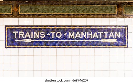 Mosaic sign at Subway Station in Brooklyn with arrow to Manhattan