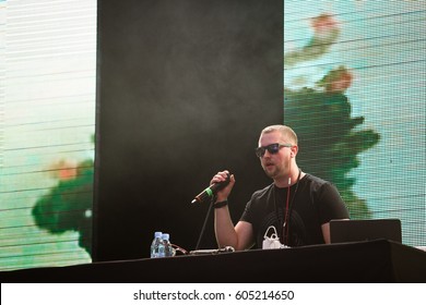 MOSCOW - 2 JUNE,2016: Dj Booch Warming Up On Stage At Big Live Concert Of Famous Russian Rap Music Singer L'One.Hip Hop Party Disc Jockey With Microphone On Scene