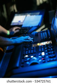 MOSCOW - 3 DECEMBER,2016: Sound technician and lights technicians control the music show in night club.Professional audio,light mixer controller panel.Pro equipment for concerts.Stage lighting control