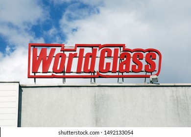 Moscow 30/08/2019 World Class Logo On Top Of Chain Gym Building Against Blue Sky