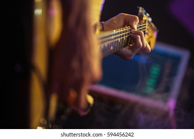 MOSCOW - 5 OCTOBER, 2016 : Russian Synth Pop Rock Group Vougal Playing Live Concert On Stage Of Night Club 16 Tonns.Guitarist Play Solo Part On Electric Guitar On Scene.Bright Concert Lighting