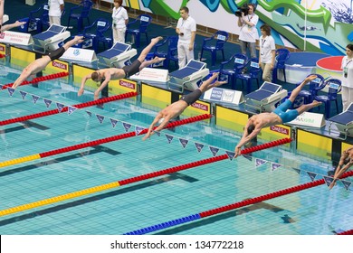 MOSCOW - APR 20: Athletes men dive into the pool in Olympic Sports complex on Championship of Russia on swimming, on April 20, 2012 in Moscow, Russia