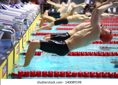 MOSCOW - APR 20: Men At The Start Of Jumping Into The Water In The Pool At The Championship Of Russia On Swimming In Olympic Sports Complex, On April 20, 2012 In Moscow, Russia