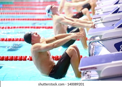 MOSCOW - APR 20: Swimmers at the start of jumping into the water in the pool  at the Championship of Russia on swimming in Olympic Sports complex, on April 20, 2012 in Moscow, Russia
