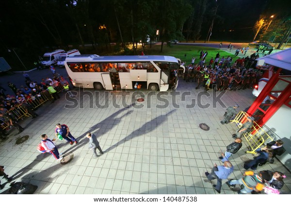MOSCOW - AUG 15: Fans are watching as players get on\
bus after match between Russia national team and Ivory Coast at\
Lokomotiv Stadium, Aug 15, 2012, Moscow, Russia. The game ended\
with the score 1:1