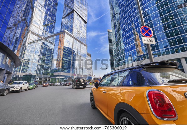 MOSCOW, AUG, 22,2017: View on Moscow biggest\
business center Moscow City office skyscrapers tower. Business\
center office car parking. Office people on street. Parking places\
absence concept image.
