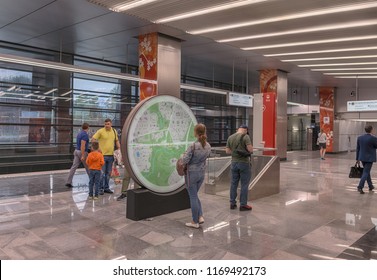 Moscow. August 30, 2018. A Woman Looks At The Map Of The City At The New Metro Station 