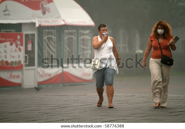 MOSCOW - AUGUST 7: Masked residents seeking to\
protect their respiratory channels as the carbon monoxide content\
in the air is increasing due to raging forest fires, August 7, 2010\
in Moscow, Russia.