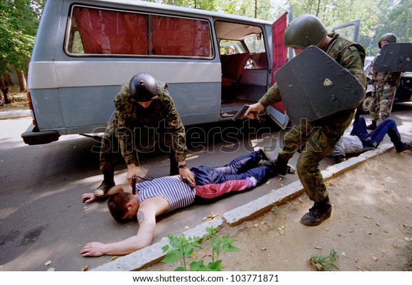 MOSCOW - AUGUST 8: Policemen\
with the organized crime task force train to arrest a suspected\
Chechen mafia car thief in Moscow, Russia, on Tuesday, August 8,\
2000.