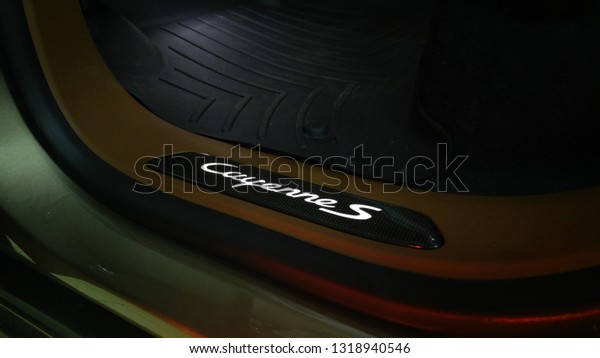 Moscow. Autumn 2018. Porsche Cayenne S car door sills.\
with diode illumination. Rubber mat in the cabin of premium SUV.\
carbon fiber side door sill plate scuff trim panel with logo\
emblem. 