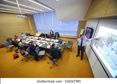 MOSCOW - DEC 20: Members At The Table Are Looking At The Board On Business Breakfast At The Office Rosbank On December 20, 2012 In Moscow Russia.