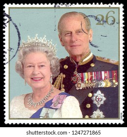 MOSCOW, December 1, 2018: Stamp Printed In United Kingdom Showing Queen Elizabeth II And Duke Of Edinburgh Prince Philip, Celebrating The Golden Anniversary Of The Royal Wedding, Circa 1997