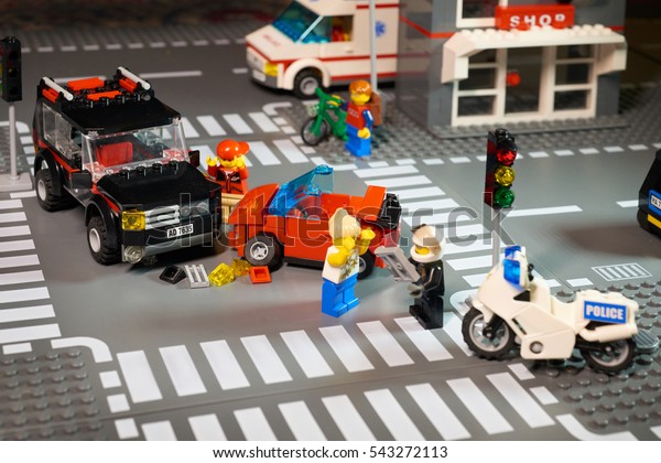 MOSCOW,\
DECEMBER 25, 2016: Lego City scene road accident - violation of\
traffic lights and regulations. Violation of traffic safety rule.\
Example for children. Ambulance police car\
bike
