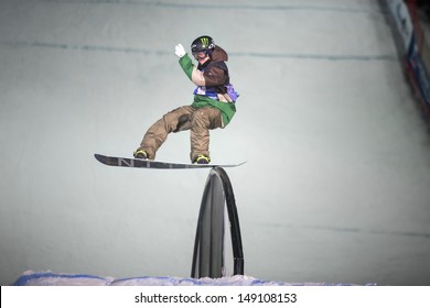 MOSCOW - FEB 16: Man On Snowboard Slides On The Rail In The Contest BGV 2013 Grand Prix De Russie In Russian Exhibition Center On February 16, 2013 In Moscow, Russia.