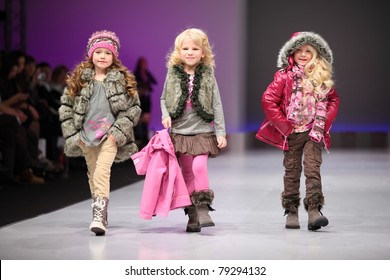 MOSCOW - FEBRUARY 22: Unidentified child models wear fashions by Snowimage and walk the catwalk in Collection Premiere Moscow, an international fashion fair for Eastern Europe, on February 22, 2011 in Moscow, Russia.
