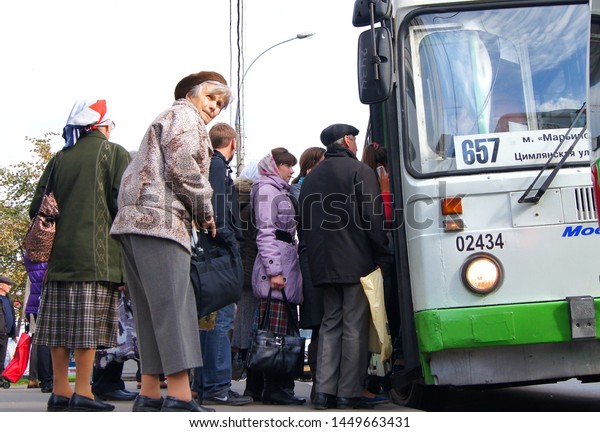 Moscow - January 2016: Public transport\
station, passengers board the shuttle\
bus.