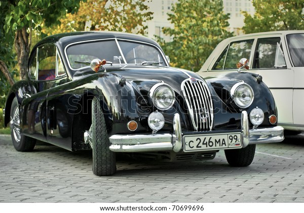 MOSCOW - JULY 31:\
Black Jaguar XK120 Classic on exhibition parking at an annual event\
the VI race of vintage cars \'Night Moscow Classic Rally\'. July 31,\
2010 in Moscow, Russia