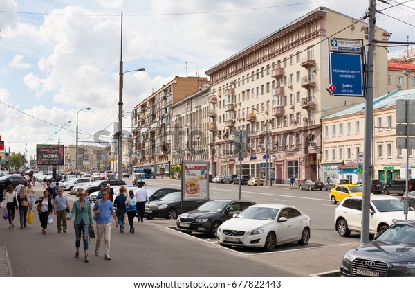 MOSCOW - JULY 5: Pedestrians and cars on\
Krasnaya Presnya street on July 5, 2017 in Moscow. Krasnaya Presnya\
street is located in the center of\
Moscow.