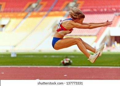 MOSCOW - JUN 11: Female athlete makes long jump at Grand Sports Arena of Luzhniki OC during International athletics competitions IAAF World Challenge Moscow Challenge, June 11, 2012, Moscow, Russia.