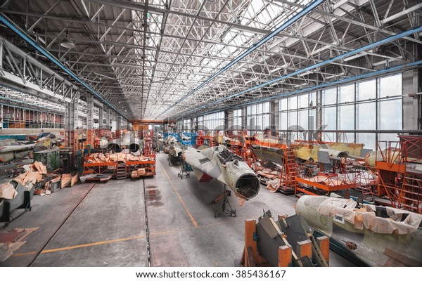 MOSCOW - JUNE 2011: Aviation factory of military\
aircraft - RSK MIG. Assembly of the Russian multirole fighter. Room\
with many planes