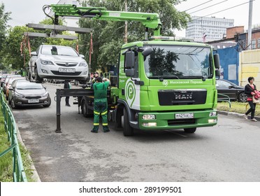 MOSCOW - JUNE 21, 2015: Tow truck at the city street.