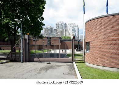 Moscow - June 5, 2022. Entrance And Iron Gate Of Sweden Embassy In Mosfilmovskaya Street Of Moscow. Sunny Summer View.