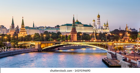 Moscow Kremlin at Moskva River, Russia. Beautiful view of the famous Moscow city center in summer. Panorama of old Moscow Kremlin and Bolshoy Kamenny Bridge at sunset. Moscow cityscape in evening.