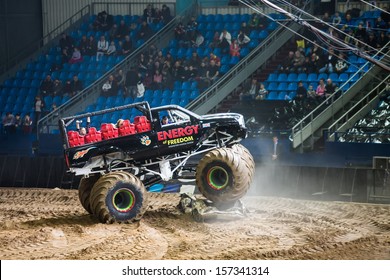 MOSCOW - MAR 23: Spectators Looking On Big Car On Show Monster Mania In Olimpiyskiy In March 23, 2013 In Moscow, Russia.