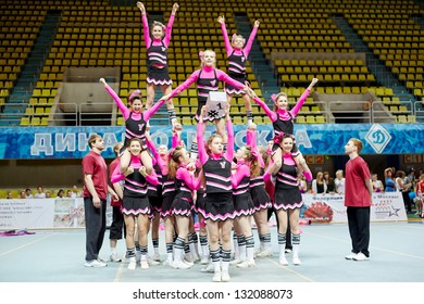 MOSCOW - MAR 24:  Cheerleaders Girl Team Performs Stunt At Championship And Contests Of Moscow In Cheerleading At Palace Of Sports Dynamo, March 24, 2012, Moscow, Russia.