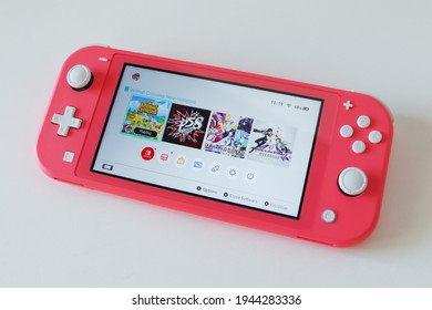 MOSCOW - MAR 27, 2021: Nintendo Switch Lite In Coral Pink Colour