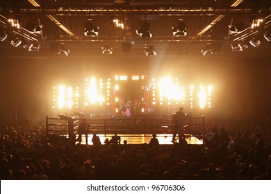 MOSCOW - MARCH 12: Stylist Sergei Zverev and his team stand near boxing ring before fight at Fight Nights Battle of Moscow-3 in Crocus City, on March 12, 2011 in Moscow, Russia.