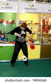 MOSCOW - MARCH 16: The guy play the yo-yo presented at the International Toy Specialized Exhibition March 16, 2011 in Moscow