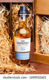 Moscow - May 10, 2019: Bottle of the Glenlivet founders reserve on a wooden box background with straw