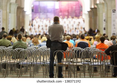 MOSCOW - MAY 19: Back Of Photographer, Which Photographs Choir At Concert Academic Big Chorus Of RSUH And Broadway At Metro Stations Kropotkinskaya As Part Of Museum Night, May 19, 2012, Moscow Russia