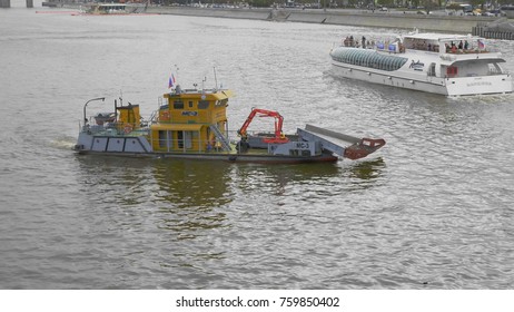 MOSCOW - MAY 7: water surface cleaning boat at Moscow river. on May 7, 2017 in Moscow, Russia.