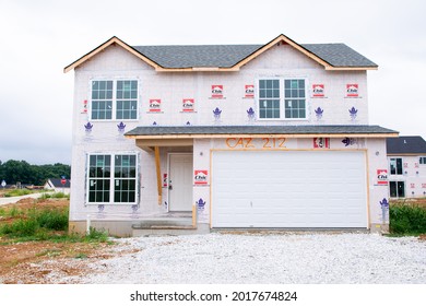 MOSCOW MILLS, MISSOURI - July 30, 2021: A Nearly Finished 2 Story New Construction Home In A Master Plan Community Is Ready For Siding And Trim During The Building Boom.