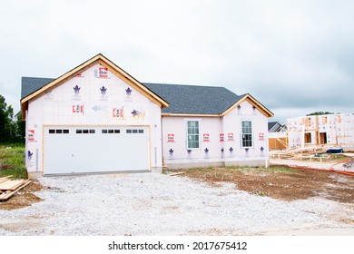 MOSCOW MILLS, MISSOURI - July 30, 2021: A Nearly Finished 2 Story New Construction Home In A Master Plan Community Is Ready For Siding And Trim During The Building Boom.