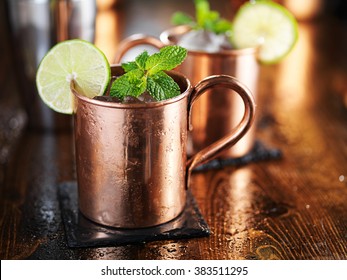 Moscow Mule Cocktail In Copper Cup With Mint And Lime Garnish