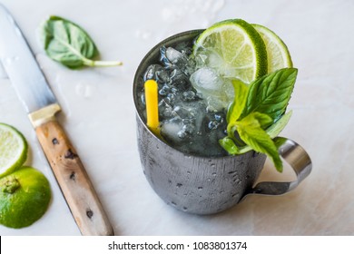 Moscow Mule Cocktail With Lime, Mint Leaves And Crushed Ice In Metal Cup.