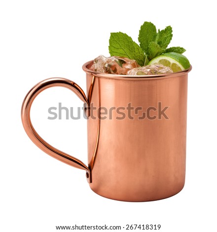 Moscow Mule in a Copper Mug. This is a Vodka drink served with mint, and a garnished with a wedge of lime, The image is a cut out, isolated on a white background, and includes a clipping path. 