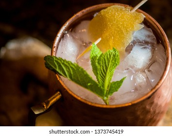 Moscow Mule Mixed Drink In Copper Mug With Candied Ginger