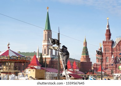 MOSCOW - NOVEMBER 13, 2019: Workers Fixes Christmas Decoration On The Red Square In Moscow.