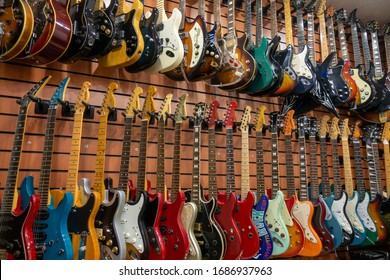 Moscow - November 15, 2019: Different Electric Guitars Hang In The Music Instruments Store For Sale