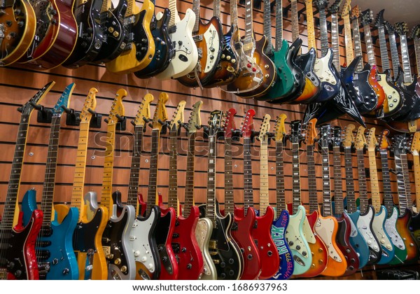 Moscow - November 15, 2019:\
Different electric guitars hang in the music instruments store for\
sale