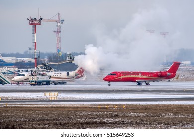 Moscow region, Domodedovo, Russia - January 03, 2016: De-icing of small passenger airplane Bombardier CRJ-100LR VQ-BND Rusline at Domodedovo international airport