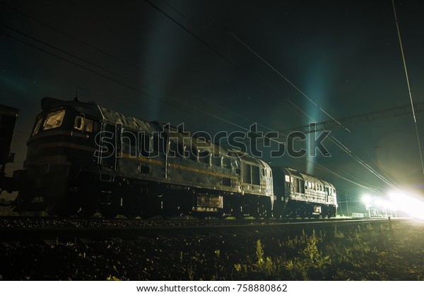 Moscow region,\
night railway, diesel locomotive at work, terminal station, hard\
job, renewing the track, track\
repair