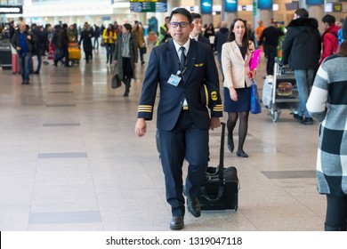 Moscow / Russia - 01.31.2018. Domodedovo International Airport. Airline Pilot Walking Through The Airport Terminal.